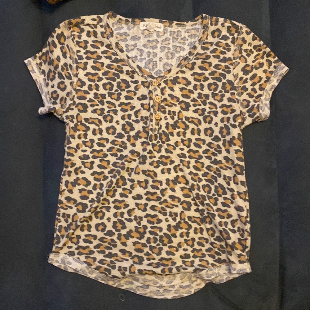Leopard print short sleeve top. Buttons are for show only non functional.